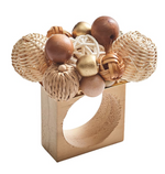 The Kim Seybert Java Napkin Ring features a rectangular wooden base with decorative rattan accents and natural-hued wooden beads for added texture.