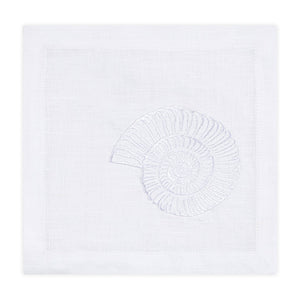 The Nautilus Shell Coaster Set by Haute Home features white linen coasters embroidered with a nautilus shell design, ideal for bringing coastal elegance to your table setting.