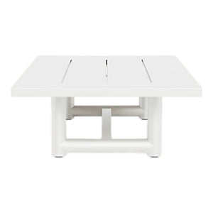 The HARBOUR OUTDOOR Breeze XL Coffee Table in White is a square aluminum table with a slatted top, thick cylindrical legs, and subtle teak accents, offering a stylish look from the front.