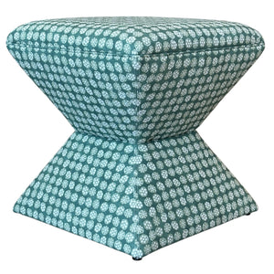 The Hamilton Outdoor Ottoman in Boheme Green by Lee Industries features a geometric, hourglass-shaped base and cushioned top with teal and white patterned upholstery—ideal as chic patio décor.
