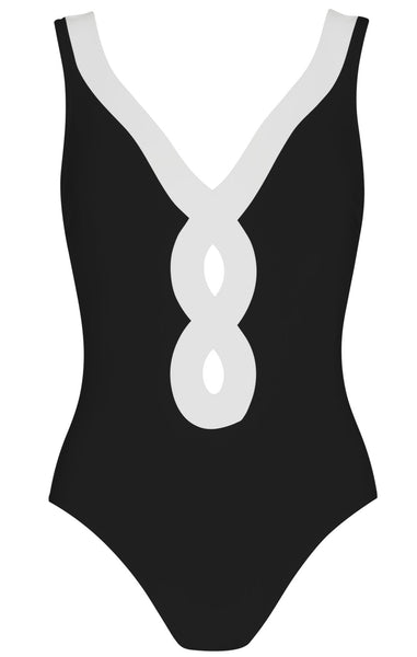 A black Karla Colletto Octavia one-piece swimsuit made of Lycra Xtra Life with a white, looped figure-eight design on the front.