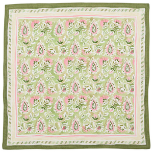 The Kim Seybert Mira Napkin Set includes square linen napkins with green, pink, and white floral and paisley patterns, finished with coordinating striped borders.
