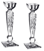 The Iris Candlestick Pair by William Yeoward Crystal features clear, faceted glass with square bases and geometric details—ideal for adding elegance to a mantle or gifting as a wedding present.
