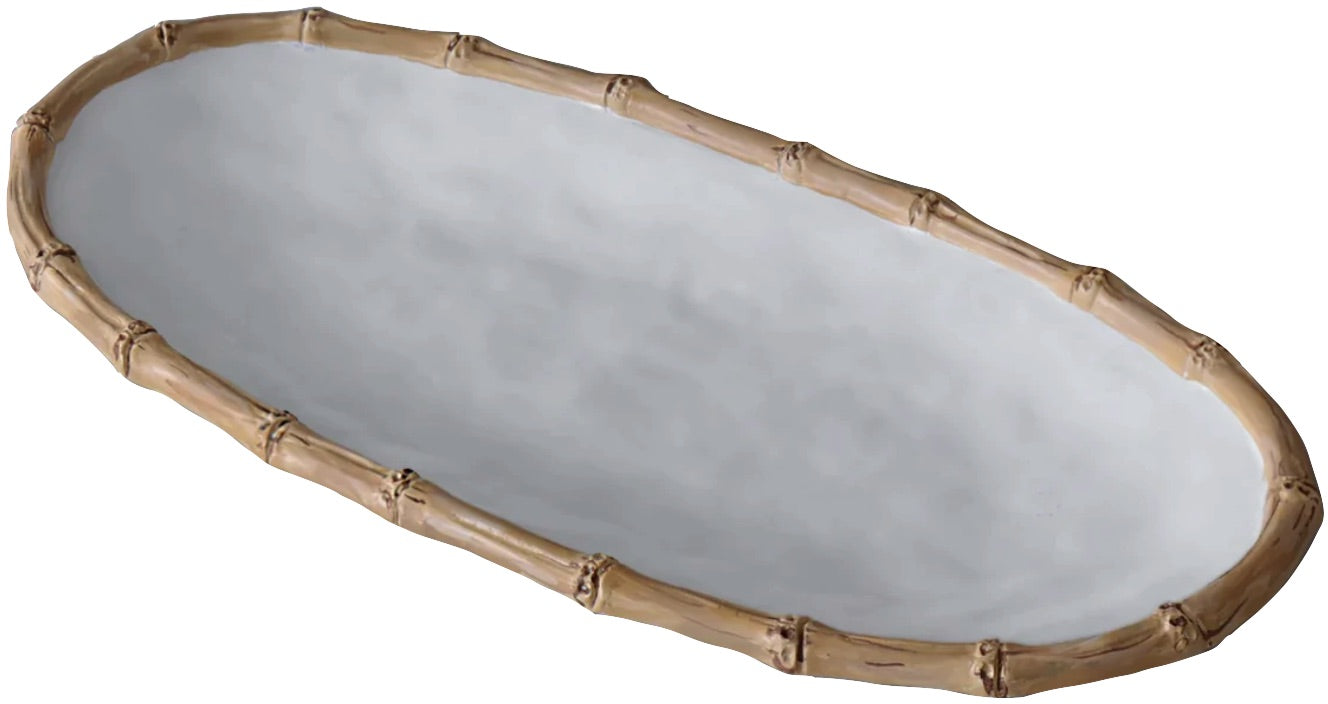An oval-shaped white ceramic tray with a bamboo-look rim from the Beatriz Ball Vida Natural Bamboo Serveware Collection, designed for durability and break resistance.