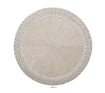 The Kim Seybert Palisade Placemat is a round, silver beaded placemat with a textured woven pattern and raised edges, ideal for formal occasions. Shown on a white background.