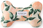 The Dog Bone Squeaky Toy Collection by Foggy Dog features a durable, handcrafted bone-shaped toy with a peach and green leaf pattern and eco-friendly materials, adding style and charm to your pup’s playtime.