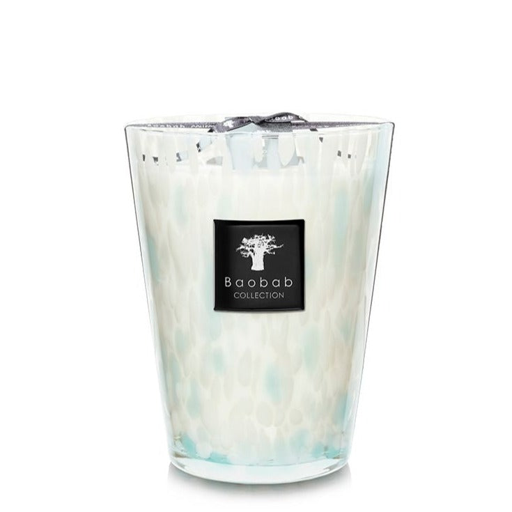 A Baobab Pearls Sapphire Candle in a white and turquoise marbled hand-blown glass container with the brand's logo on the front.
