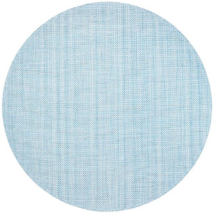 The Kim Seybert Portofino Placemat features a round, light blue design with a subtle woven vinyl texture and faint intersecting lines, and is easy to clean.