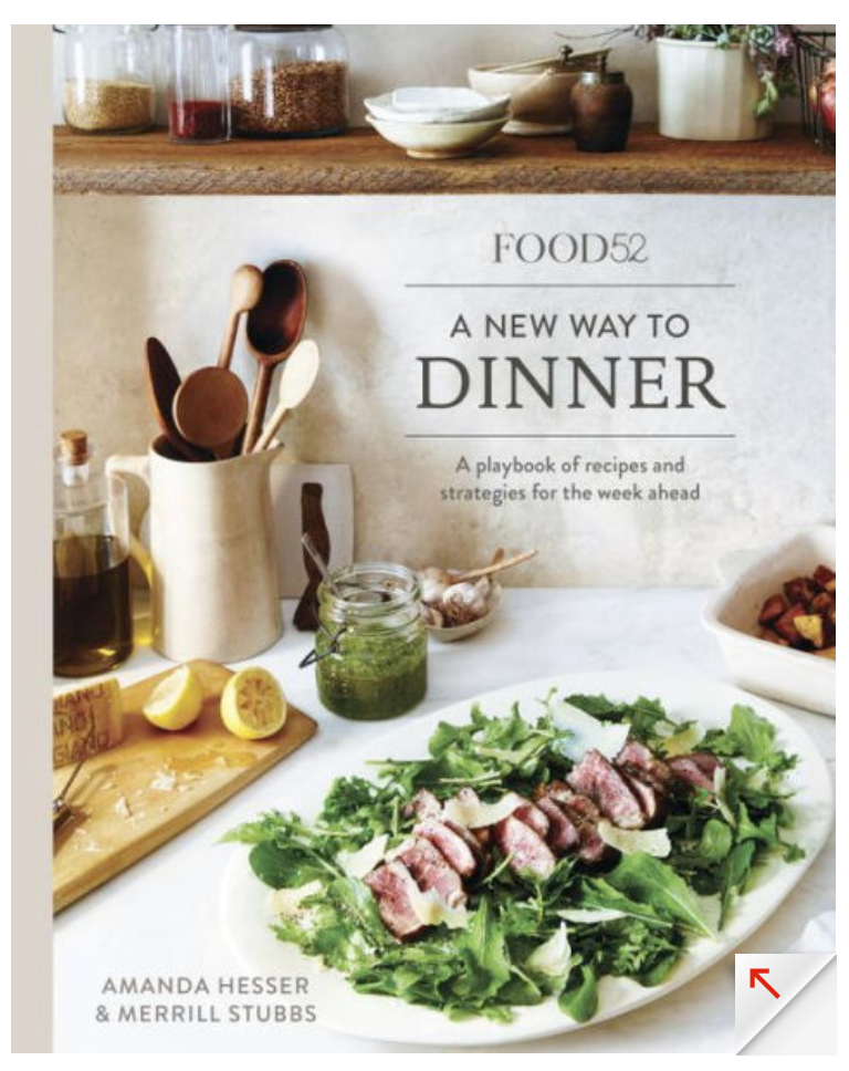 The cover of "Food52 A New Way To Dinner" by Penguin Random House features a colorful salad with sliced meat, lemons, utensils, and jars—ideal inspiration for seasonal meal planning and delicious homemade dinners.
