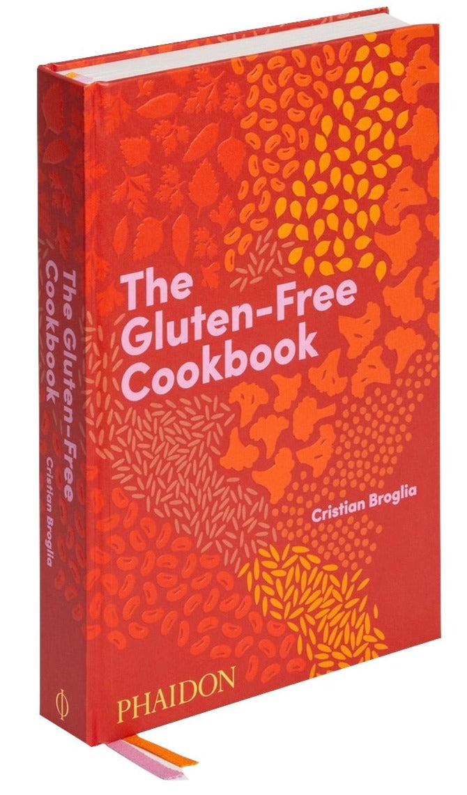 The cover of Phaidon's "The Gluten-Free Cookbook" by Cristian Broglia features a vibrant pattern in orange and red, reflecting the diversity of global recipes.