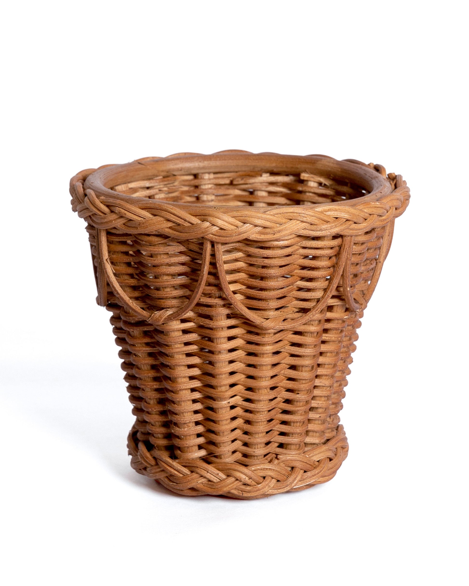 The Sharland England Pinet Plant Pot Collection features a round, empty wicker cachepot basket with a braided rim and scalloped edge, perfect as a stylish houseplant holder, shown against a plain white background.