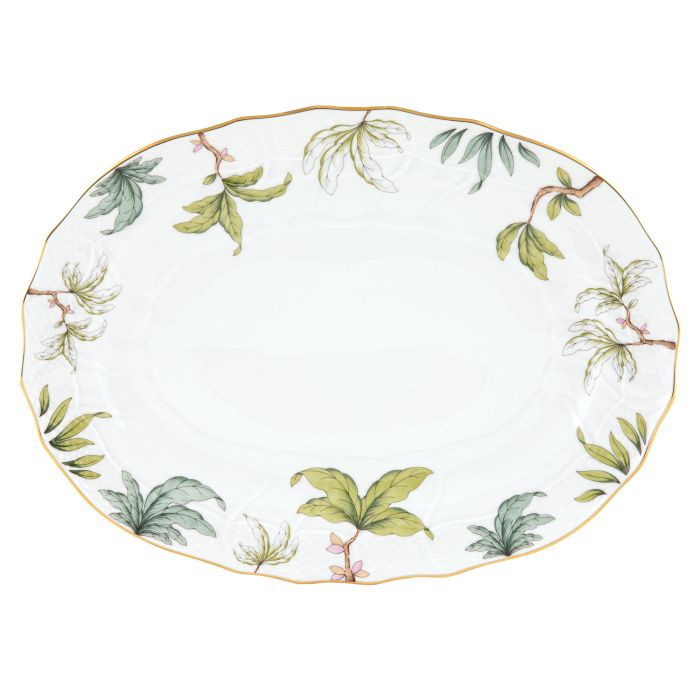The Herend Foret Garland Collection features a white oval ceramic platter with a scalloped edge, adorned with green botanical leaf designs and gold trim, crafted in an artistic porcelain style.