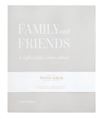 Front cover of the Family and Friends Photo Album by PrintWorks, showcasing a minimalist beige design with white text and stylish photo storage on high-quality black photo paper.