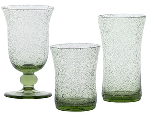 Three green-tinted pieces from Juliska’s Provence Basil Drinkware Collection, featuring bubbled texture and unique shapes, are displayed on a white background.