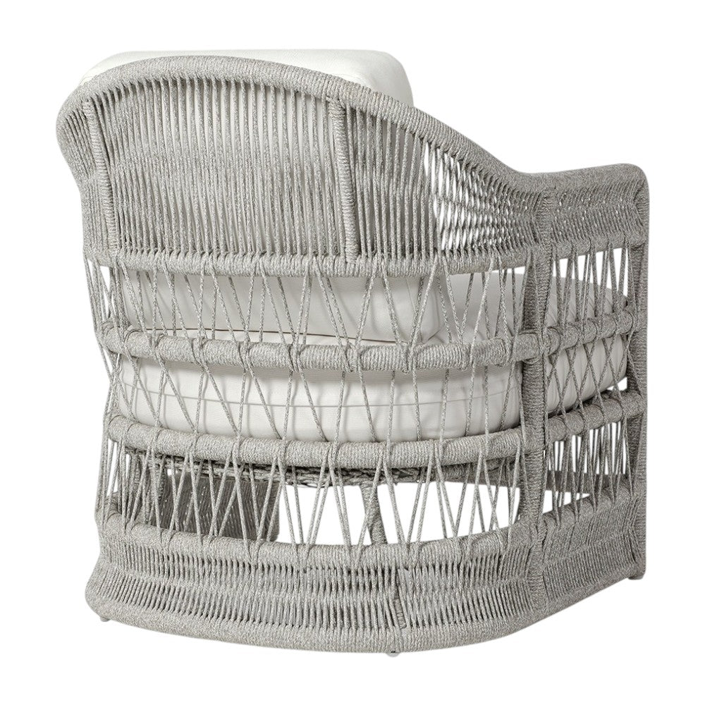 The Mara Outdoor Lounge Chair in Rough 'N Tumble Blanca by PALECEK features a gray woven frame, circular base, thick white cushions, and an open crisscross rope design for a luxurious blend of coastal and natural style.