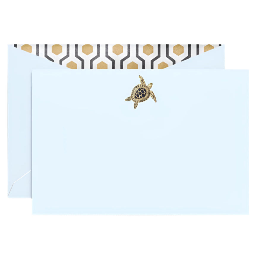 The Crane Sea Turtle Beach Glass Flat Card Set features a light blue envelope with a gold sea turtle seal and black and gold deco lining, offering an elegant introduction.