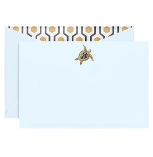 The Crane Sea Turtle Beach Glass Flat Card Set features a light blue envelope with a gold sea turtle seal and black and gold deco lining, offering an elegant introduction.