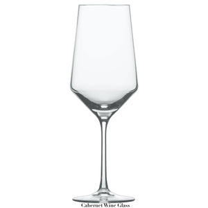A clear, empty Fortessa Pure Collection cabernet wine glass with a long stem and wide bowl is centered on a white background.