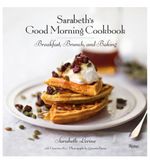 The cover of Sarabeth's Good Morning Cookbook: Breakfast, Brunch, and Baking (Rizzoli) shows waffles topped with whipped cream, fruit, and seeds, perfectly reflecting the delicious breakfast recipes inside. A blurred syrup jar appears in the background.