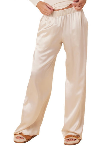 Woman wearing cream-colored Sablyn Brynn Silk Pant and sandals.