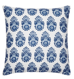 The Adira Indigo Outdoor Pillow by John Robshaw is a square white pillow with rows of blue bhuti flowers inspired by indigo block designs.