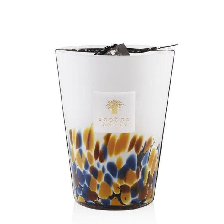 Decorative Baobab Collection Rainforest Mayumbe scented candle by Baobab, featuring a spotted blue, yellow, and white pattern on a hand-blown glass container.