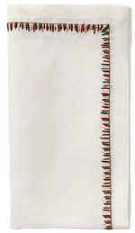 The Kim Seybert Filament Napkin Set features a folded white linen napkin with exquisite red, green, and black embroidered stitching along the edge.