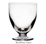 A clear, stemmed glass with a wide bowl from the Barre Drinkware Collection by Simon Pearce, featuring handmade glassblowing artistry—luxury drinkware for any occasion.