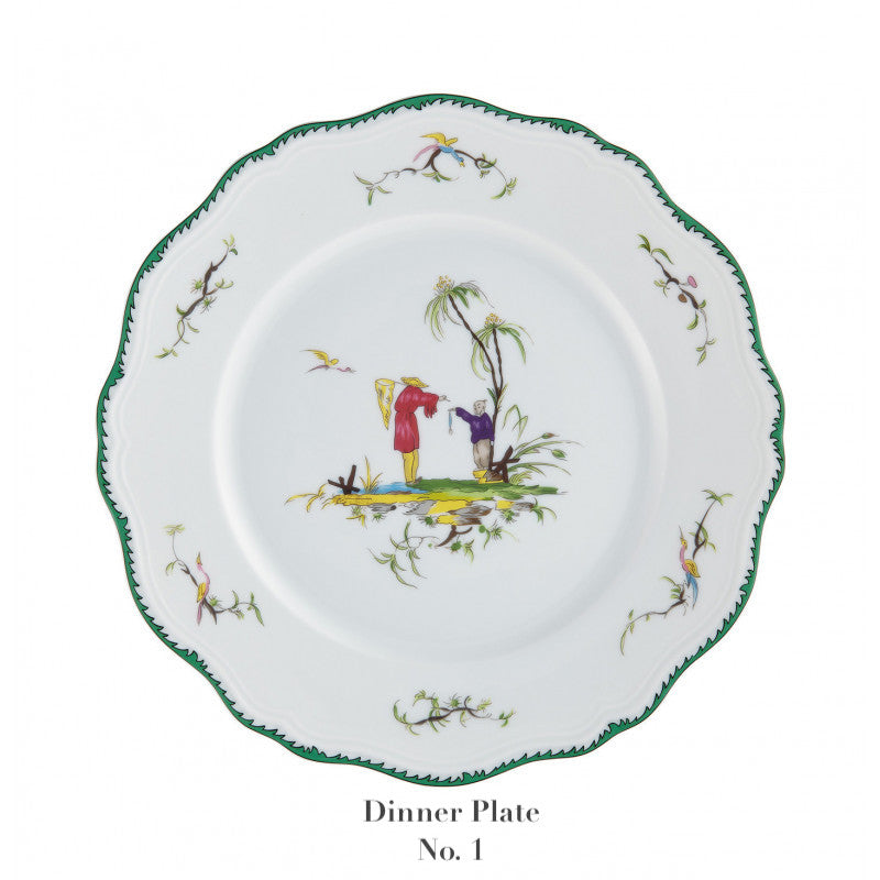 The Raynaud Longjiang Dinnerware Collection dinner plate features white porcelain with a scalloped green-trimmed edge, floral accents, and a central pastoral scene of two figures by a tree. Below is the text: "Dinner Plate No. 1.