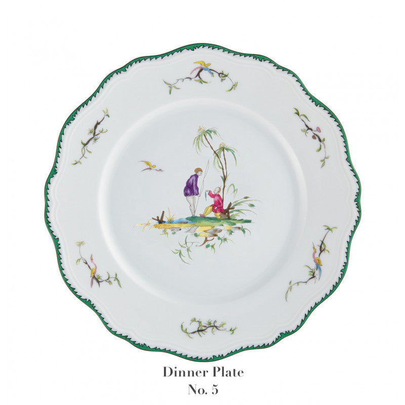 The Raynaud Longjiang Dinnerware Collection dinner plate features a scalloped green-trimmed edge, floral rim accents, and a central illustration of two people by a tree in a classic pastoral scene. Text below reads "Dinner Plate No. 5".