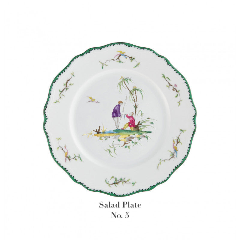 The Raynaud Longjiang Dinnerware Collection salad plate features a white base with a scalloped green rim, floral accents, and two figures by a tree, reminiscent of classic pastoral scenes. Text below reads “Salad Plate No. 5.”.