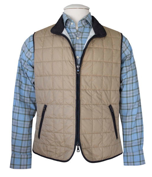 A mannequin wearing a Waterville Theo Quilted Nylon Vest and plaid shirt, with a double-zip front closure.