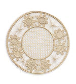 Themis Z’s Serenity Rattan Placemat Collection features round, handcrafted placemats with a woven lattice center and decorative floral edge, made from natural fibers.