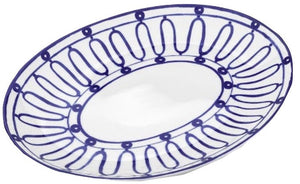 The Kyma Blue Serving Platter by Themis Z features a white oval shape with a blue geometric rim, inspired by the Greek Aegean Sea, from the Serenity collection.