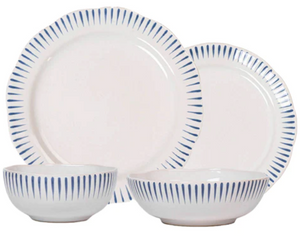 Four white ceramic dishes—two plates and two bowls—from Juliska’s Sitio Stripe Delft Blue Dinnerware Collection feature radiant blue stripes, arranged as an elegant tabletop setting on a plain white background.