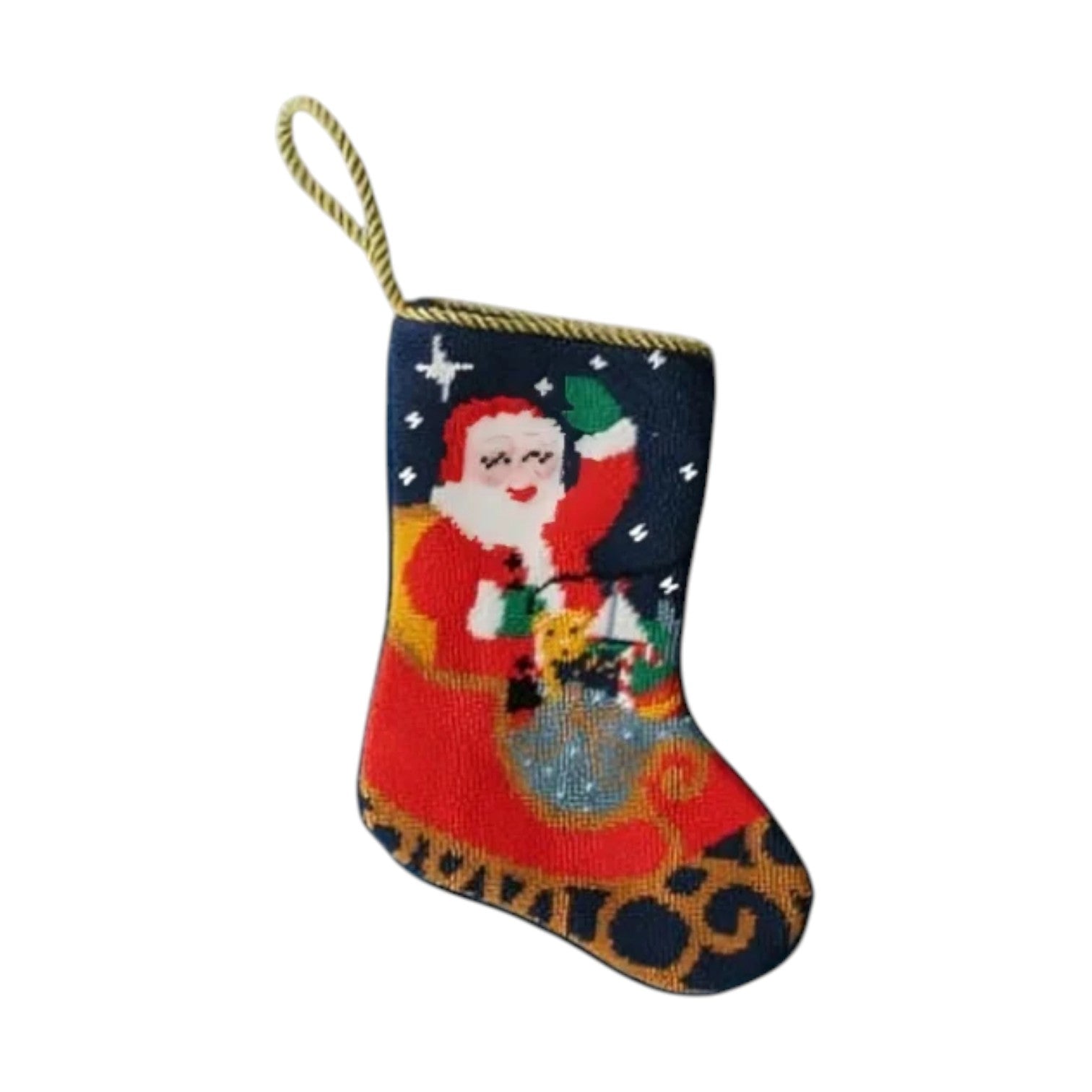 The Bauble Stockings "Sleigh Ride Santa" features a hand-stitched needlepoint Santa holding a green gift bag, adorned with stars and a hanging loop—ideal as festive décor or a unique Christmas ornament.