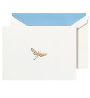 The Crane Dragonfly Card Set features a white card with a gold dragonfly illustration, partially tucked into an envelope lined with blue.