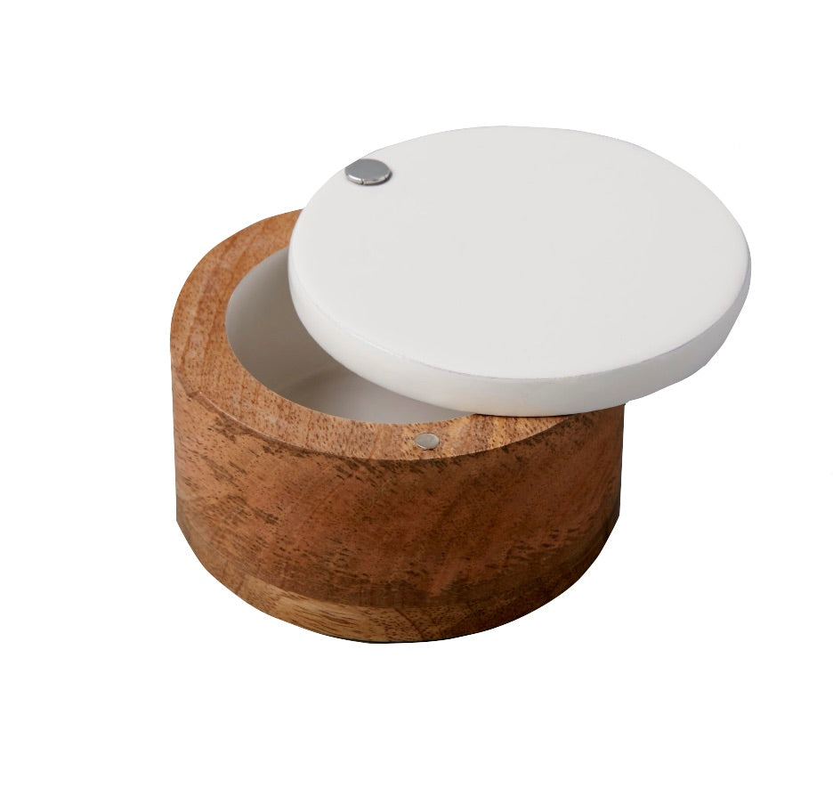 The Be Home Madras Classic Spice Cellar features a round mango wood container with an open white lid and metal hinge, revealing the empty interior. Crafted from sustainably sourced materials for eco-friendly style.