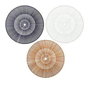 Three Kim Seybert Spoke Placemats, including a white version, are displayed in a triangular formation on a white background, blending organic elements with subtle geometric patterns.