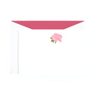 The Crane Peony Flat Note Card Set by Crane features white notecards with a pink peony illustration at the top and matching envelopes with pink lining—an elegant choice for any occasion.