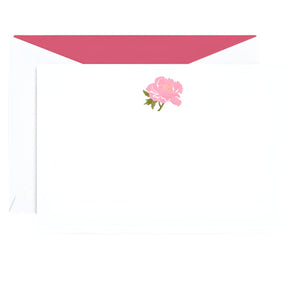 The Crane Peony Flat Note Card Set by Crane features white notecards with a pink peony illustration at the top and matching envelopes with pink lining—an elegant choice for any occasion.
