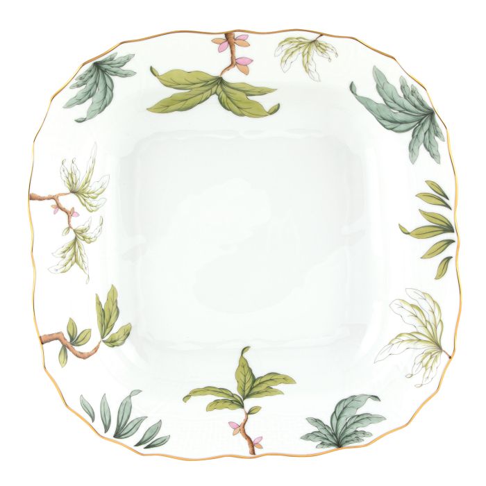 The Foret Garland Collection by Herend features a square white porcelain plate with a gold rim, adorned with green leaves and small pink flowers along the border.