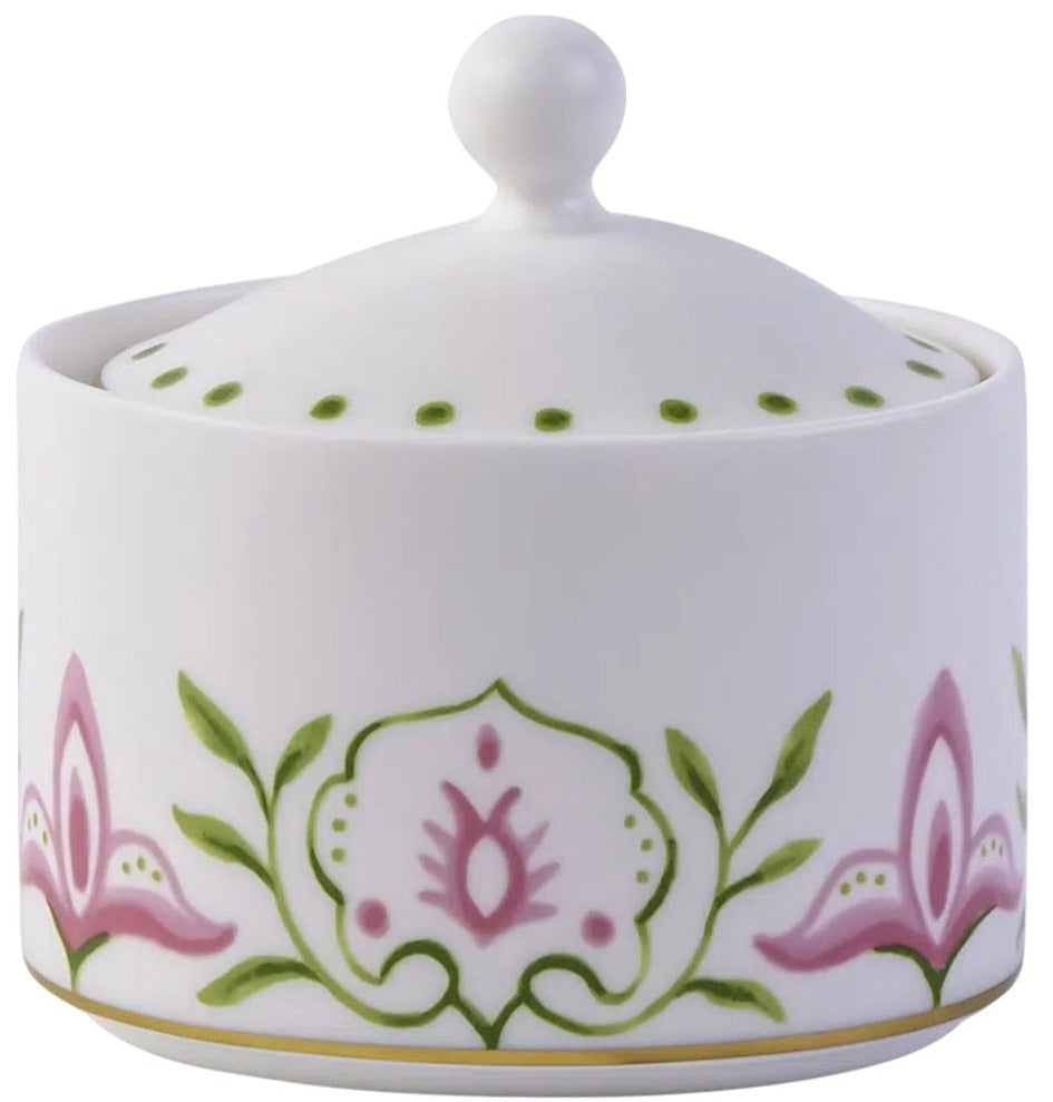 A white fine bone china sugar bowl with lid from the Royal Crown Derby Cobblers Cove Camelot Dinnerware Collection, featuring pink and green floral designs and a round handle inspired by classic elegance.