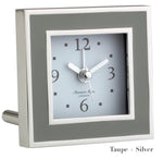 The Square Silver Alarm Clock by Addison Ross features a taupe and silver frame, white face, black numerals, and three hands—ideal for your bedside table.