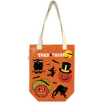 Cavallini Papers and Co Tote Bag Trick or Treat: orange heavyweight natural cotton canvas tote with flat bottom, Halloween-themed designs (pumpkins, owl, black cat, bats), and “Trick or Treat” in white text.