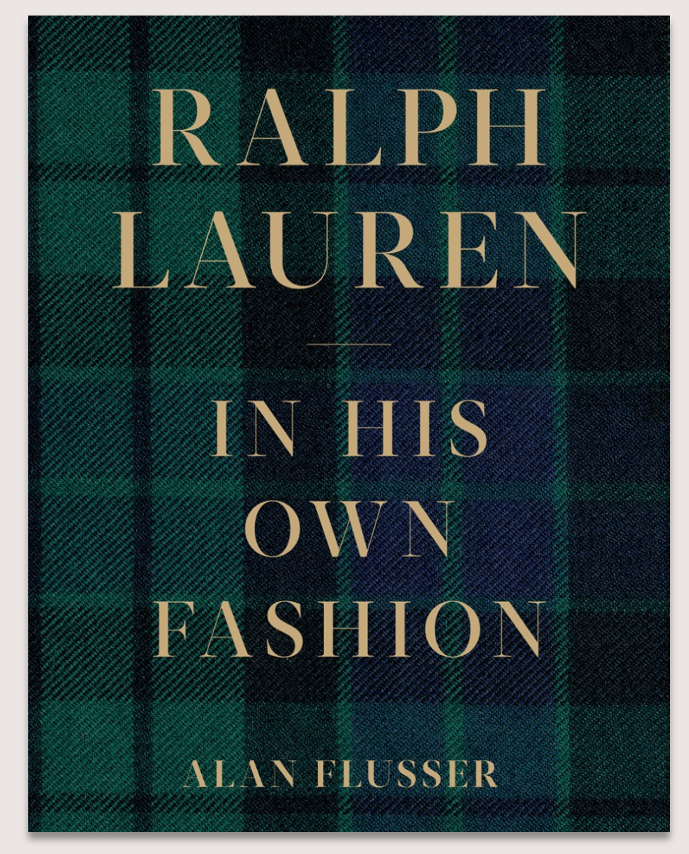The cover of Abrams' "Ralph Lauren: In His Own Fashion" displays gold text set against a dark green and navy plaid background.