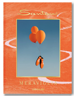 Orange shoes tied to three matching balloons float against a blue sky on the cover of “Santoni Meraviglia” by Assouline, celebrating Italian craftsmanship and artisanal excellence.