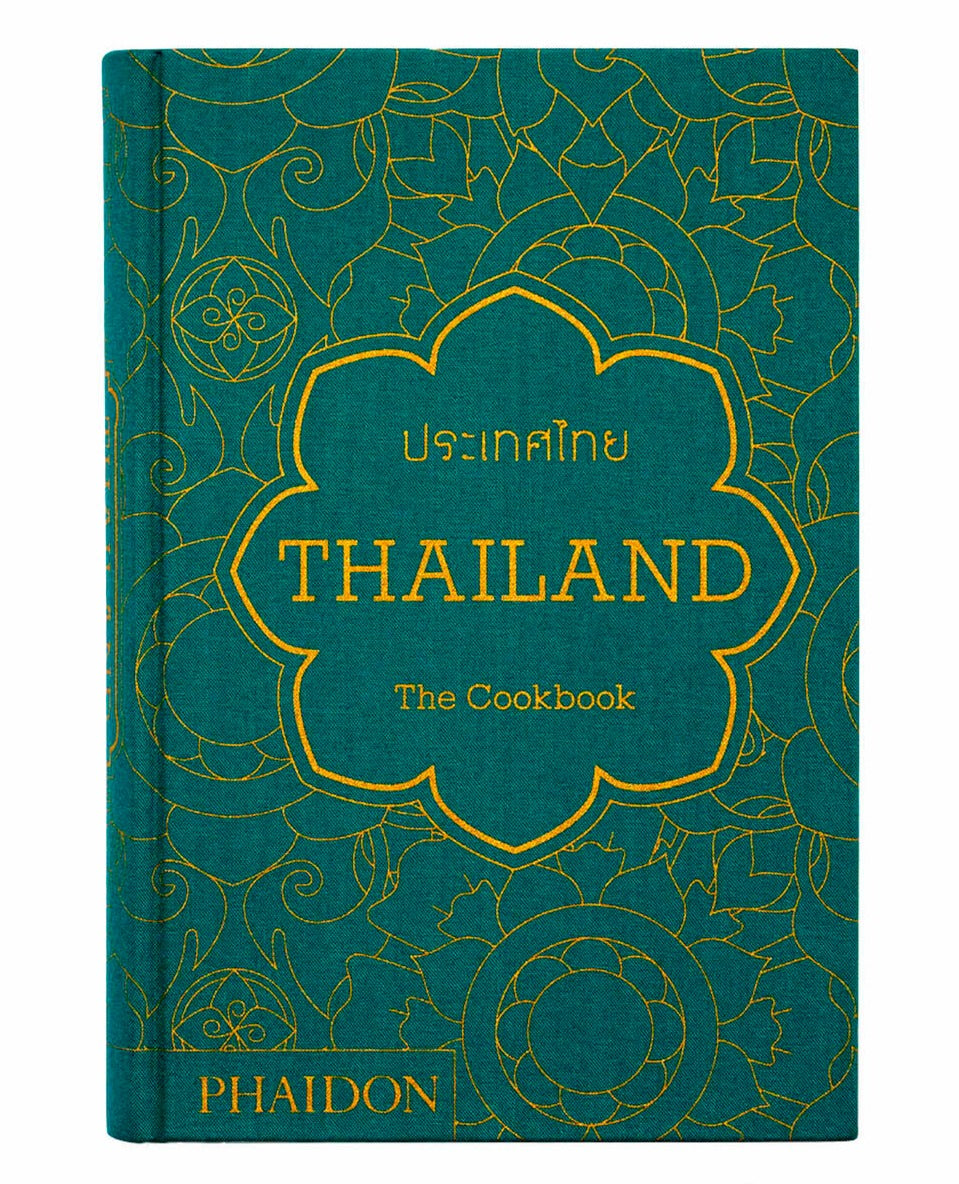 A green cookbook with golden ornate patterns titled "Thailand: The Cookbook" by Phaidon, featuring the exotic flavors of Thai cuisine.