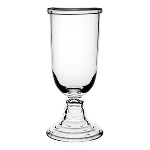 The Tilly Footed Hurricane by William Yeoward Crystal features a tall bowl and wide, tiered base, recalling antique style—perfect for outdoor entertaining on a plain white background.