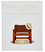 The book "The New Southern Style" by Graphic Image features a cover with a wooden chair, hat, and patterned rug against a white background, reflecting modern Southern interior design.
